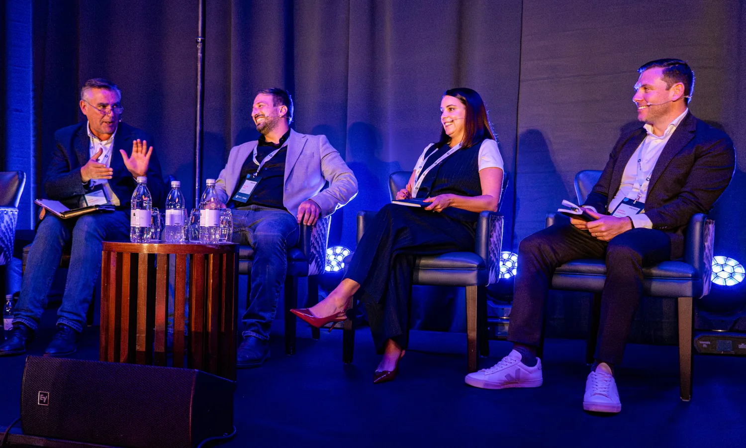 Panellists in conversation on stage at the 2025 Cyber Ireland conference